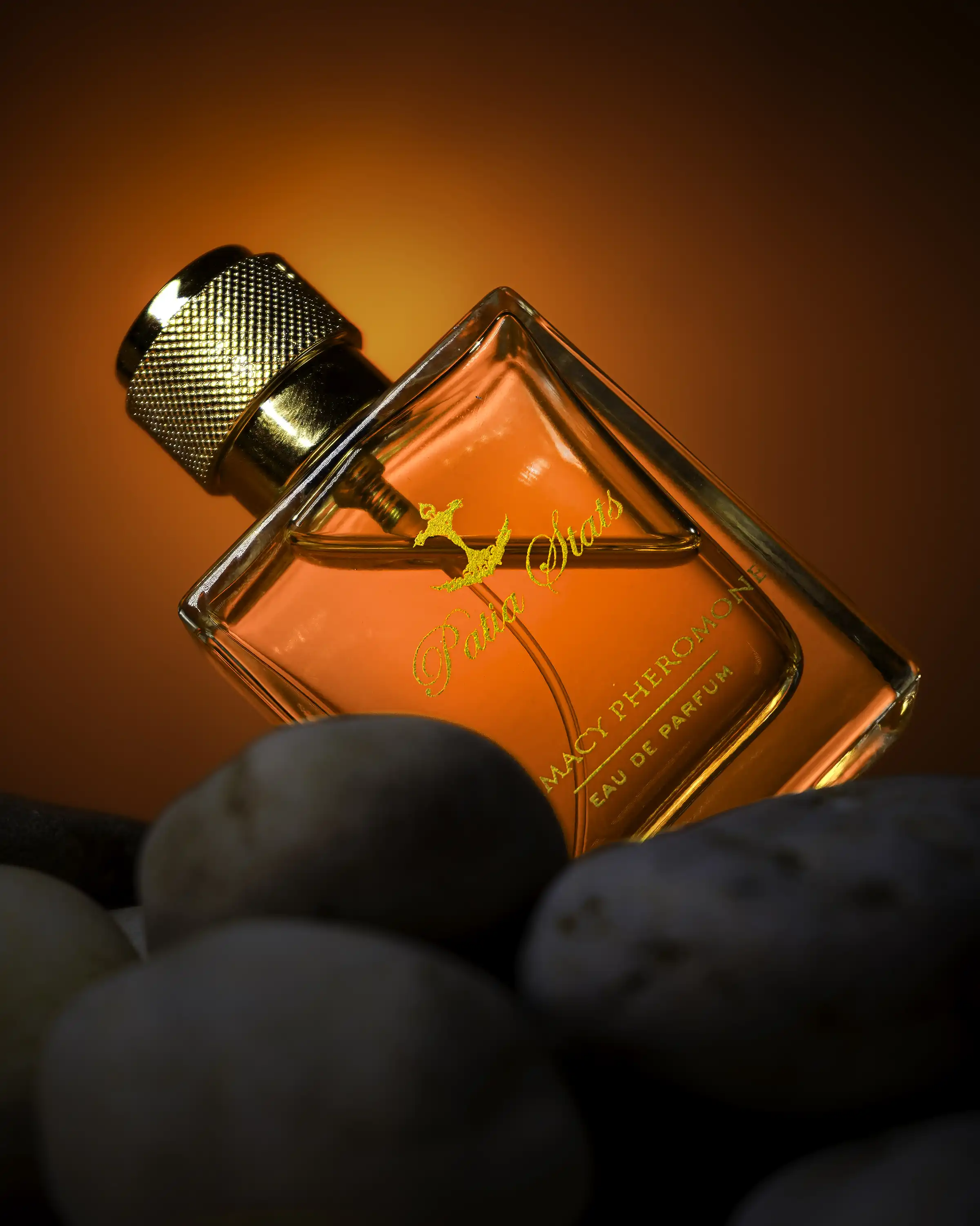 Patia Stats Perfume – Red Background Angle